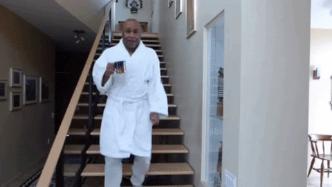 Guy running down stairs with coffee